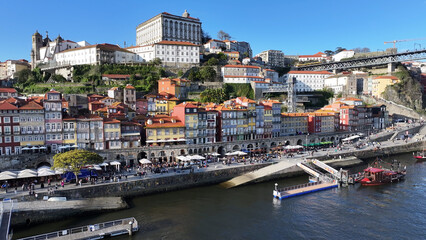Fototapeta premium Ribeira Pier At Porto In District Of Porto Portugal. Downtown District. Medieval Buildings. Historical City Scene. Ribeira Pier At District Of Porto In Portugal. Tourism Landmarks.