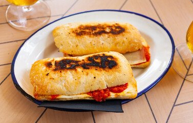 Homemade hot crispy sandwich with chorizo and cheese