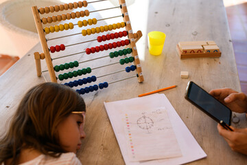 Child Learning with Abacus and Smartphone, Education Concept