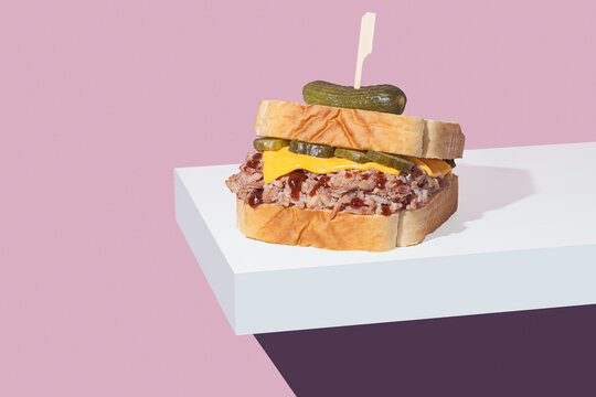 Gourmet pulled pork sandwich on colorful background