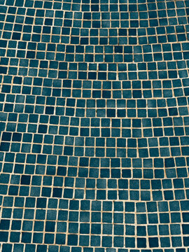 Abstract blue tiled wall with geometric mosaic pattern