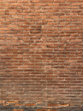 Brick wall with uniform red pattern