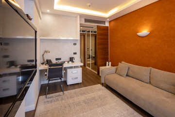 Modern hotel room with cozy sofa