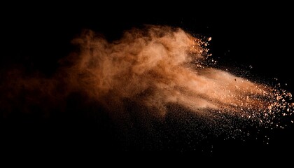 brown powder explosion on black background colored cloud colorful dust explode paint holi