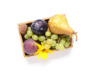 Wooden box with different fresh fruits on white background