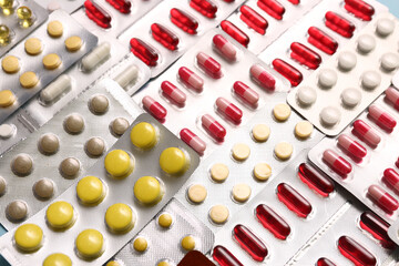 Blister packs with different pills as background