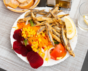 Dish with fried sardines, pilchards or anchovies in batter for a traditional Spanish meal