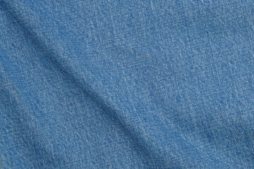 Blue denim fabric wavy surface texture background.Copy space for text.For graphic design,3D rendering and banner background