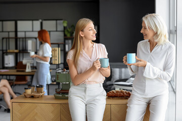 Women having coffee break in office