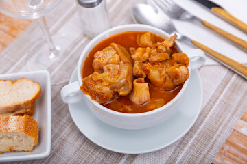 Popular dish of Spanish cuisine is Manos de cerdo, made from pork legs with tomato sauce and pepper