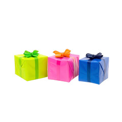 Three colorful gift boxes with shiny wrapping and bows are arranged in row, featuring vibrant neon green, pink, and blue colors. festive presentation evokes sense of celebration and joy