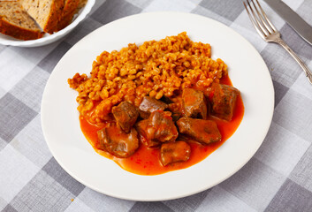 Tender pieces of beef in gravy with pearl barley