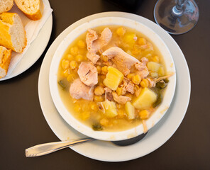 Popular dish of Spanish cuisine is Cocido de garbanzos, made from meat, vegetables and chickpeas