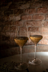 Visit of wine cellar, tasting of brut champagne sparkling wine produced by traditional method in underground caves close up