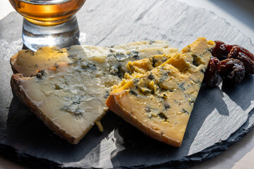 Cheese plate, English cow milk semi-soft, crumbly old blue stilton and blue shropshire cheeses...