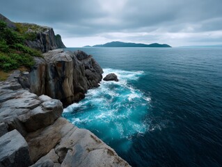 Fototapeta premium Serene Coastal Cliffs with Crashing Waves Under Overcast Sky