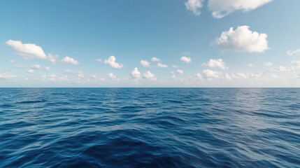 Fototapeta premium Calm ocean waves reflect serene sky with fluffy clouds, creating tranquil atmosphere