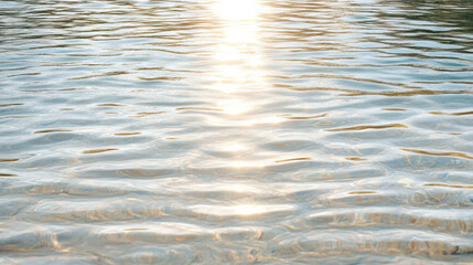 Glistening water surface reflects sunlight, creating serene and tranquil atmosphere