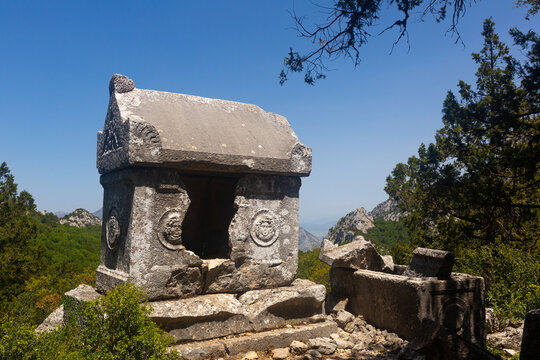 Reliefs on sarcophagus rock tombs at unique Southwest necropolis Termessos ancient city, Antalya in Turkey mountains