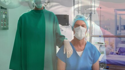 Mature female surgeon guiding senior patient in OR featuring French flag overlay with monitor icons - Powered by Adobe