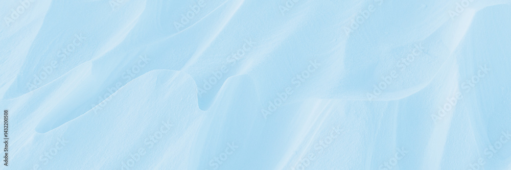 Wall mural snow texture. wind sculpted patterns on snow surface. wind in the tundra and in the mountains on the