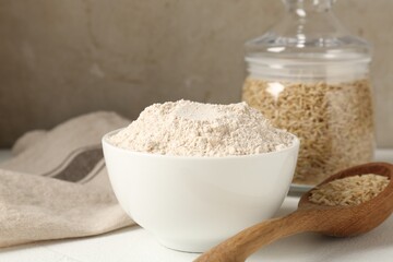 Brown rice and flour on white table