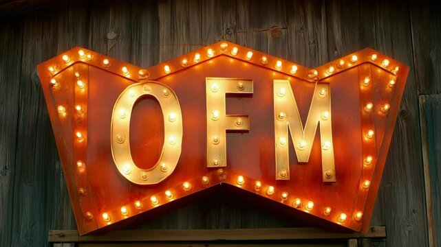 Illuminated vintage style sign displaying bold letters on aged wood surface, creating a bright and nostalgic atmosphere.