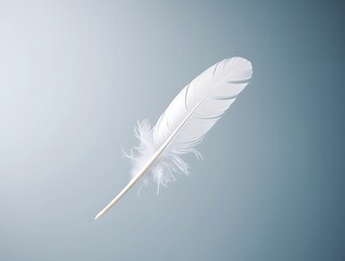 Obraz premium White feather floating gently in the air on a soft blue background, symbolizing peace, purity, and lightness in a minimalistic and serene visual concept