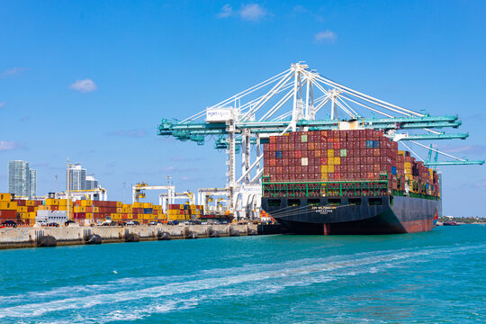 April 14, 2025. Zim Wilmington Singapore Cargo Container Ship Docked at Port Miami Sailing Under the Flag of Singapore, Florida, USA.