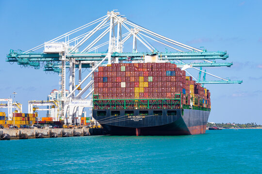 April 14, 2025. Zim Wilmington Singapore Cargo Container Ship Docked at Port Miami Sailing Under the Flag of Singapore, Florida, USA.