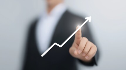 Business professional indicates growth trend with finger on a digital graph in a modern office setting.