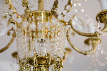 Luxurious Gold Chandelier with Cascading Crystal Prisms