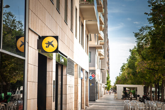 VALENCIA, SPAIN - OCTOBER 13, 2024: CaixaBank logo on their office in Valencia. Caixa Bank is a spanish bank and a financial service group.