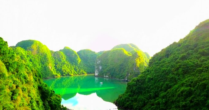 Dreamy sunset landscape Halong Bay, Vietnam view from adove. This is the UNESCO World Heritage Site, a beautiful natural wonder in northern Vietnam. Vietnam halong bay. Island in the sea. Drone 