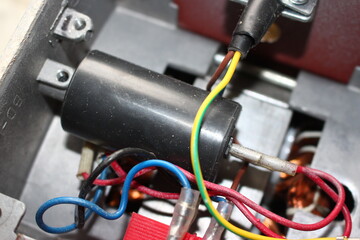 Six microfarad starting capacitor in a brushless induction motor