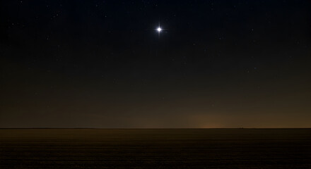 Bright Star Shines Over Tranquil Rural Landscape At Night Time