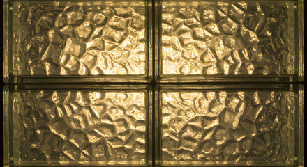 A Wall of Sparkling Translucent Glass Blocks Creating Geometric Patterns