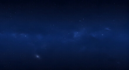 Fototapeta premium Enigmatic Deep Blue Night Sky Displaying Scattered Stars And Hazy Clouds