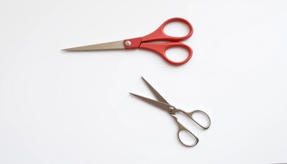 Red and Metal Scissors on White Background