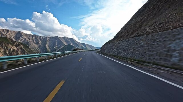 Driving a car through winding mountain road
