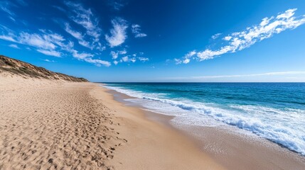 Fototapeta premium Serene beach scene tranquil ocean waves and sandy shore