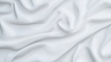 Fototapeta premium A close-up of white fabric, showcasing smooth, flowing textures and subtle details in the weave, conveying elegance and softness.