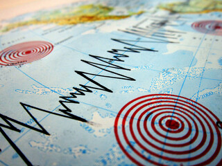 Seismograph and earthquake. Seismic activity of an earthquake. Earthquake occurring under the sea. Tsunami.