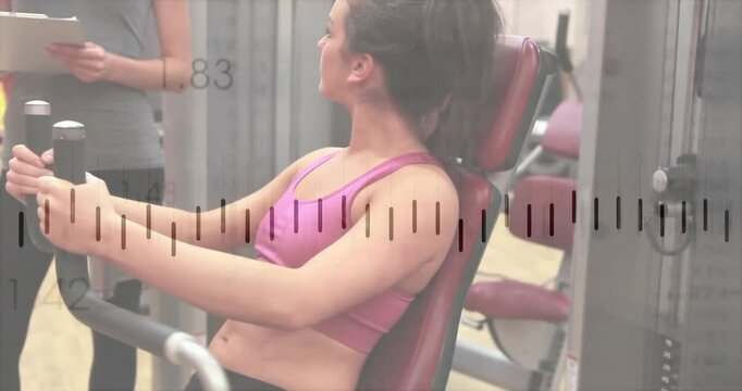 Trainee woman performing chest fly on pec deck in fitness gym, showing floating clipboard graphic