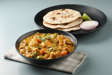 Indian food Tandoori roti or nan, Indian flat bread with Mix vegetable curry  