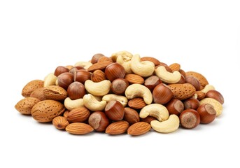 A pile of mixed nuts including almonds cashews and hazelnuts on a white background in a studio shot