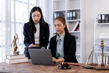 Asian Business woman and lawyer discuss the contract document. Treaty of the law. Sign a contract business lawyer Business partnership meeting concept.
