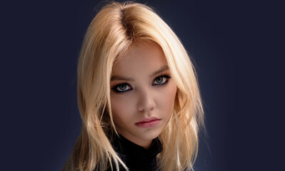 Naklejka premium Young woman close-up portrait. Sensual lady headshot. Pretty girl. Female fashion model closeup.