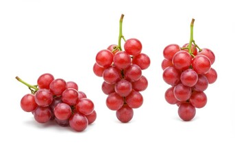 Fototapeta premium Three bunches of vibrant red grapes isolated on a crisp white background showcasing their juicy plumpness and fresh appearance