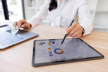 Business finance accounting banking concept. Business woman hand doing tablet finances and calculate on desk about cost at home office. working on desk with using calculator, finance accounting.